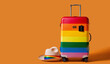 © asife - Trolley suitcase decorated with the colors of the LGBT flag and straw hat