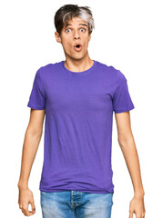 Poster - Young hispanic man wearing casual clothes scared and amazed with open mouth for surprise, disbelief face