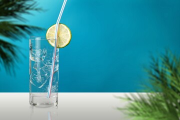 Wall Mural - Cold water with ice in glass, summer drink.