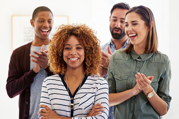 Canvas Print - Motivated leaders create motivated teams. Portrait of a team of colleagues standing in an office and clapping.