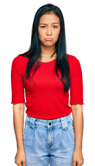 Poster - Beautiful hispanic woman wearing casual clothes depressed and worry for distress, crying angry and afraid. sad expression.