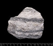 Gneiss metamorphic rock macro shot isolated on black background