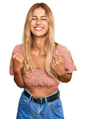 Poster - Beautiful blonde young woman wearing summer top excited for success with arms raised and eyes closed celebrating victory smiling. winner concept.