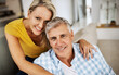 © M Moller/peopleimages.com - The only secret to a long marriage is love. Cropped shot of a loving mature couple relaxing at home.