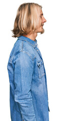 Sticker - Caucasian man with blond long hair wearing casual denim jacket looking to side, relax profile pose with natural face and confident smile.