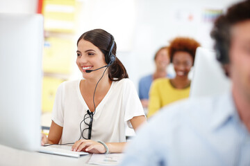 Poster - Shes ready to assist. Cropped shot of an attractive young call center operator in the office.