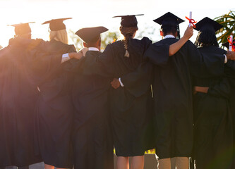 Poster - Weve come so far together. Rearview shot of a group of university students standing together on graduation day.