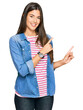 © Krakenimages.com - Young brunette woman wearing casual clothes smiling and looking at the camera pointing with two hands and fingers to the side.