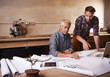 © M Moller/peopleimages.com - Passing along all his knowledge. Cropped shot of a father and son working together in their workshop.