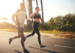 © Donson/peopleimages.com - In the fitness game for the long run. Shot of a fit young couple going for a run outdoors.