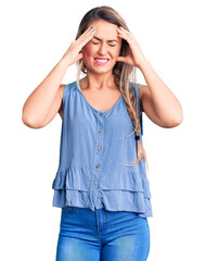 Sticker - Young beautiful blonde woman wearing casual sleeveless t-shirt suffering from headache desperate and stressed because pain and migraine. hands on head.