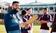 © Anela R/peopleimages.com - Sports, portrait or happy man with a strategy, planning or training progress for a game field formation. Leadership, mission or manager coaching men or rugby group for fitness idea or team goals