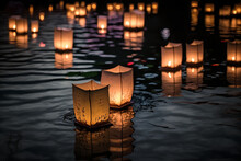Paper Lanterns Representing Spirits Of The Departed Float On Dark Water During The Traditional Floating Lantern Festival, A Time-honored Memorial Day To Honor Loved Ones Who Have Passed Away.