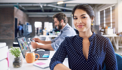 Teamwork, business and portrait of woman at desk with laptop at creative agency, working on web project together. Leadership, coworking and happy employees at design startup with smile and technology