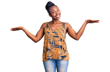 Poster - Young african american woman wearing casual clothes smiling showing both hands open palms, presenting and advertising comparison and balance