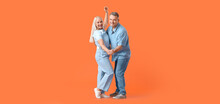 Dancing Mature Couple On Orange Background