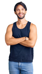 Poster - Handsome hispanic man wearing casual clothes happy face smiling with crossed arms looking at the camera. positive person.