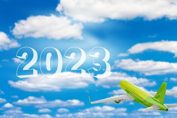 Sticker - Airplane fly in blue sky with numbers 2023 in clouds