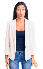 Sticker - Young beautiful latin girl wearing business clothes scared and amazed with open mouth for surprise, disbelief face