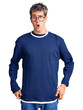 © Krakenimages.com - Young handsome man wearing casual clothes and glasses afraid and shocked with surprise expression, fear and excited face.