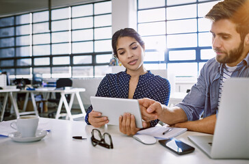 Poster - Internet, tablet and woman with man in office sharing idea or opinion at meeting for creative project. Team, social media and employees in startup discussion at design agency for content marketing.