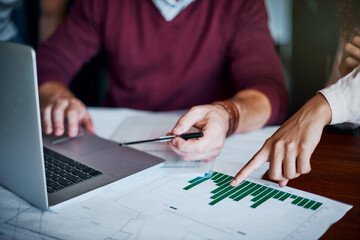 Poster - Our charts and stats are looking good. Shot of two unrecognizable businesspeoples hands pointing at charts and working in the office.