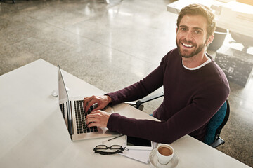 Aufkleber - My desk is where I make things happen. Portrait of a young businessman working at his desk in a modern office.