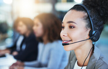 Wall Mural - every customer is our top customer. shot of a young woman working in a call centre.