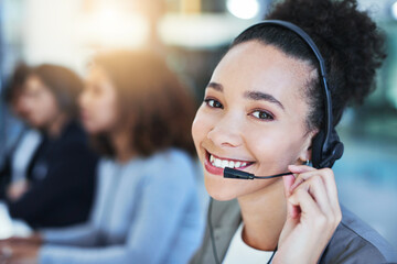 Wall Mural - its my duty to assist. portrait of a young woman working in a call centre.