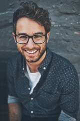 Aufkleber - Hes excited about the future. Portrait of a handsome young man outside.