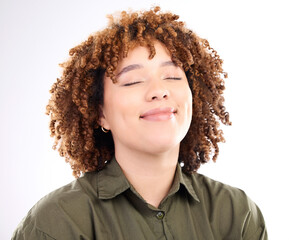 Face, content and peaceful with a black woman in studio isolated on a white background for quiet. Eyes closed, freedom and calm with an attractive young female posing to promote wellness or zen