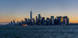 © porqueno - Manhattan at Sunrise with Sun reflecting on skyscrappers and Staten ISland Ferry in the foreground