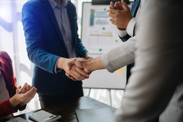 Two confident business man shaking hands during a meeting in the office, success, dealing, greeting and partner in sun light