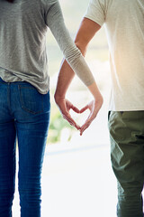 Canvas Print - One love. Cropped shot of a couple making a hear gesture with their hands.