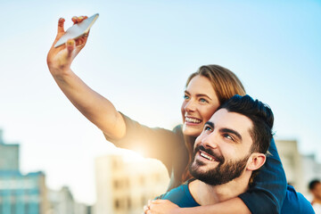 Poster - Selfie to look back at this day. Shot of a young couple taking a selfie outside.