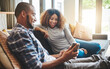 © Donson/peopleimages.com - The healthy marriage keeps the lines of communication open. Shot of a young couple relaxing on the sofa at home and using a mobile phone together.