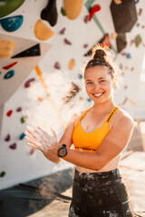 Wall Mural - Climber wearing in climbing equipment. Practicing rock-climbing on a rock wall outdoor. Xtreme sports and bouldering concept.  rock climber climbs on a rocky wall.