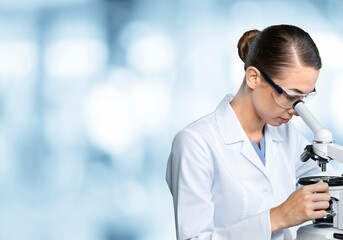 Wall Mural - Scientist person works on microscope in modern laboratory