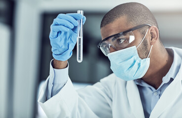 Aufkleber - The mysteries of the physical and chemical world intrigue me. Shot of a young scientist conducting an experiment in his lab.