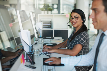 Aufkleber - Ready and available to take your call. Portrait of a happy and confident young woman working in a call center.
