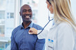 © Sharne T/peopleimages.com - Patient, doctor woman and consultation with stethoscope in hospital for cardiology or health insurance. Black man and healthcare person talking about lungs, breathing and advice for healthy heart