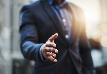 Poster - You look like youd make a great business partner. Closeup shot of an unrecognizable businessman extending a handshake in the city.