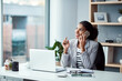 © Chanelle M/peopleimages.com - People with passion make things happen. Shot of a young businesswoman using a mobile phone at her desk in a modern office.