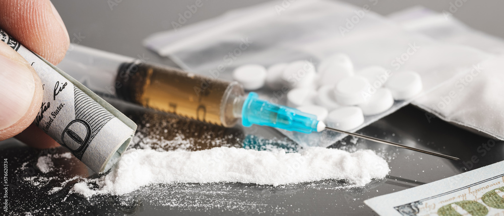 Snorting cocaine, white powder line, rolled up dollar bill, white pills ...