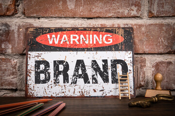 Wall Mural - brand concept. warning sign with text on wooden shelf