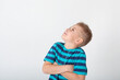 © Светлана Винокурова - Portrait of beautiful little boy giving you thumbs up over yellow background.