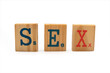 © Paulrommer - word sex in wood isolated on white background
