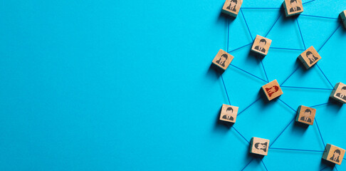 Organization structure, social network and teamwork concept on blue background. Business people icon on wooden cube blocks connecting network of connections