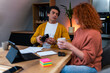 © DusanJelicic - A multiracial couple has a problem with finances, they don't have enough money to meet their budget. Tablet, notebook, post it notes and papers on the table