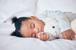 © T Mdlungu/peopleimages.com - Black child, baby and sleeping with toy in bedroom, home and nursery for peace, calm nap and dreaming. Tired young girl kid asleep with teddy bear for resting, break and healthy childhood development